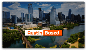 Aerial view of downtown Austin with modern skyscrapers, a river in the foreground, and a bridge crossing the water; banner reads 'Austin Based' in orange.